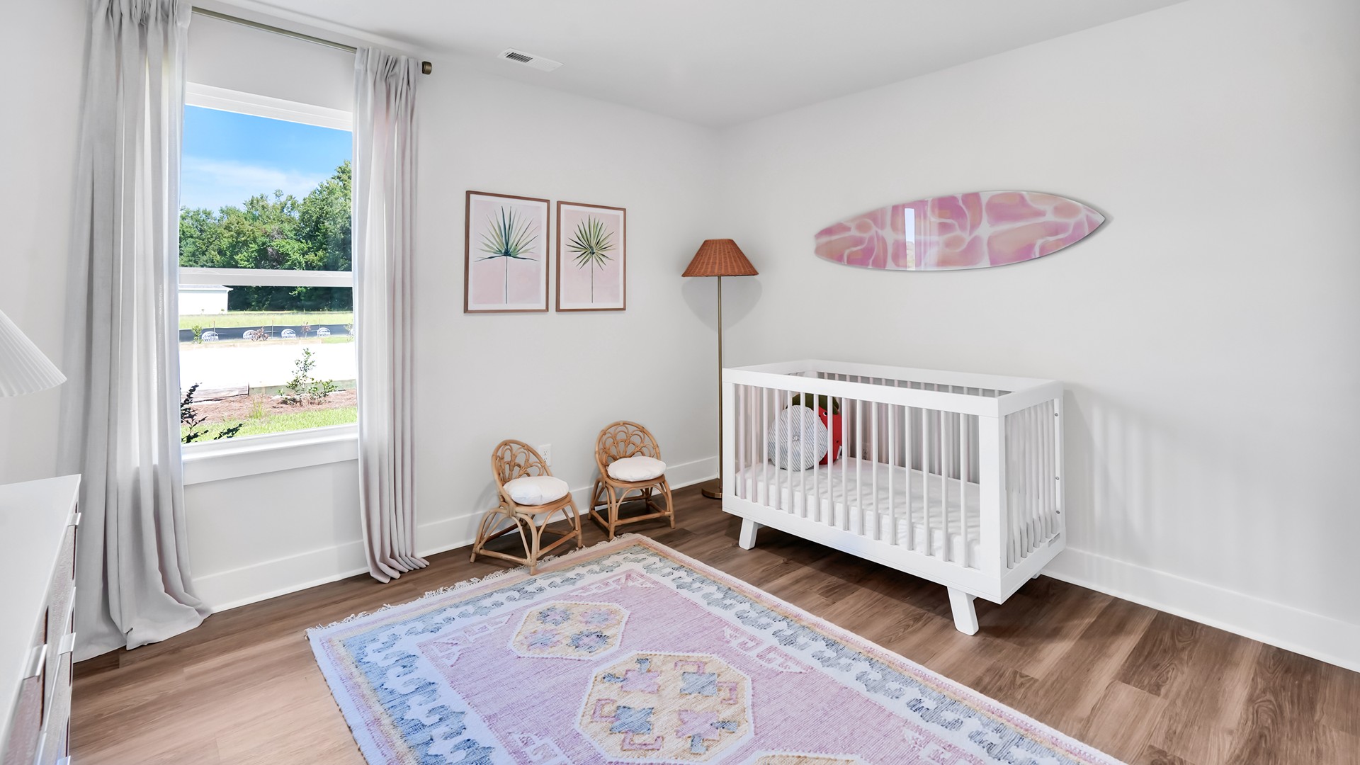 Further down the entry hall is a laundry room with cubbies. Adjacent to the entry area is Bedroom 2, a versatile space that can serve as a guest room or home office. It has access to a full bathroom situated next to the laundry room.