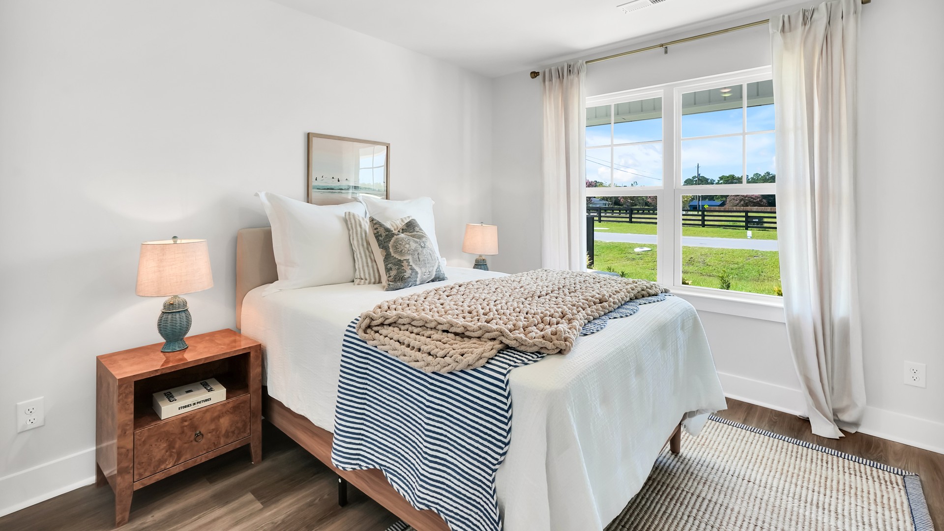 he main level is designed for both functionality and social gatherings, starting with a covered porch that leads into a foyer. From the foyer, you can access a two-car garage and a half bath