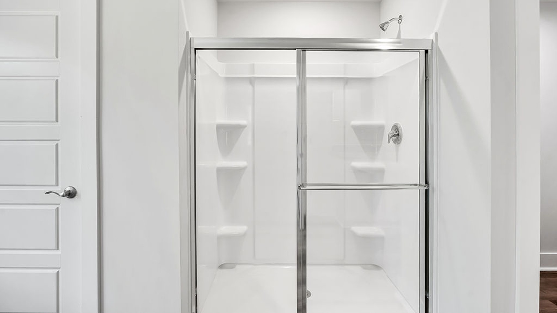 Adjacent to the entry area is Bedroom 2, a versatile space that can serve as a guest room or home office. It has access to a full bathroom situated next to the laundry room.
