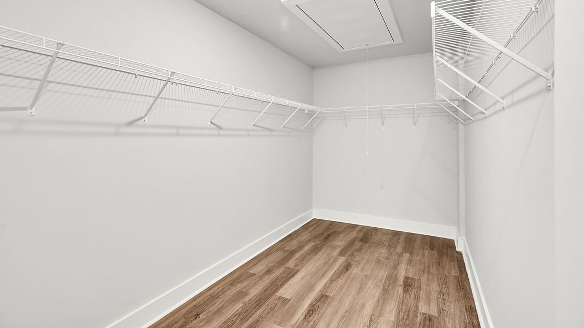 Adjacent to the entry area is Bedroom 2, a versatile space that can serve as a guest room or home office. It has access to a full bathroom situated next to the laundry room.