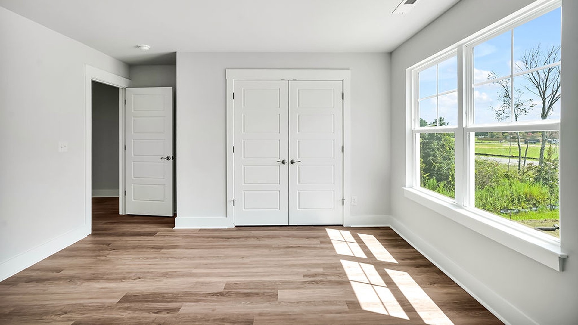 The Guilford second story provides a private living area separate from the main floor, which includes a large upstairs living room, the Primary Bedroom suite, and three additional bedrooms with shared access to bathrooms and laundry facilities