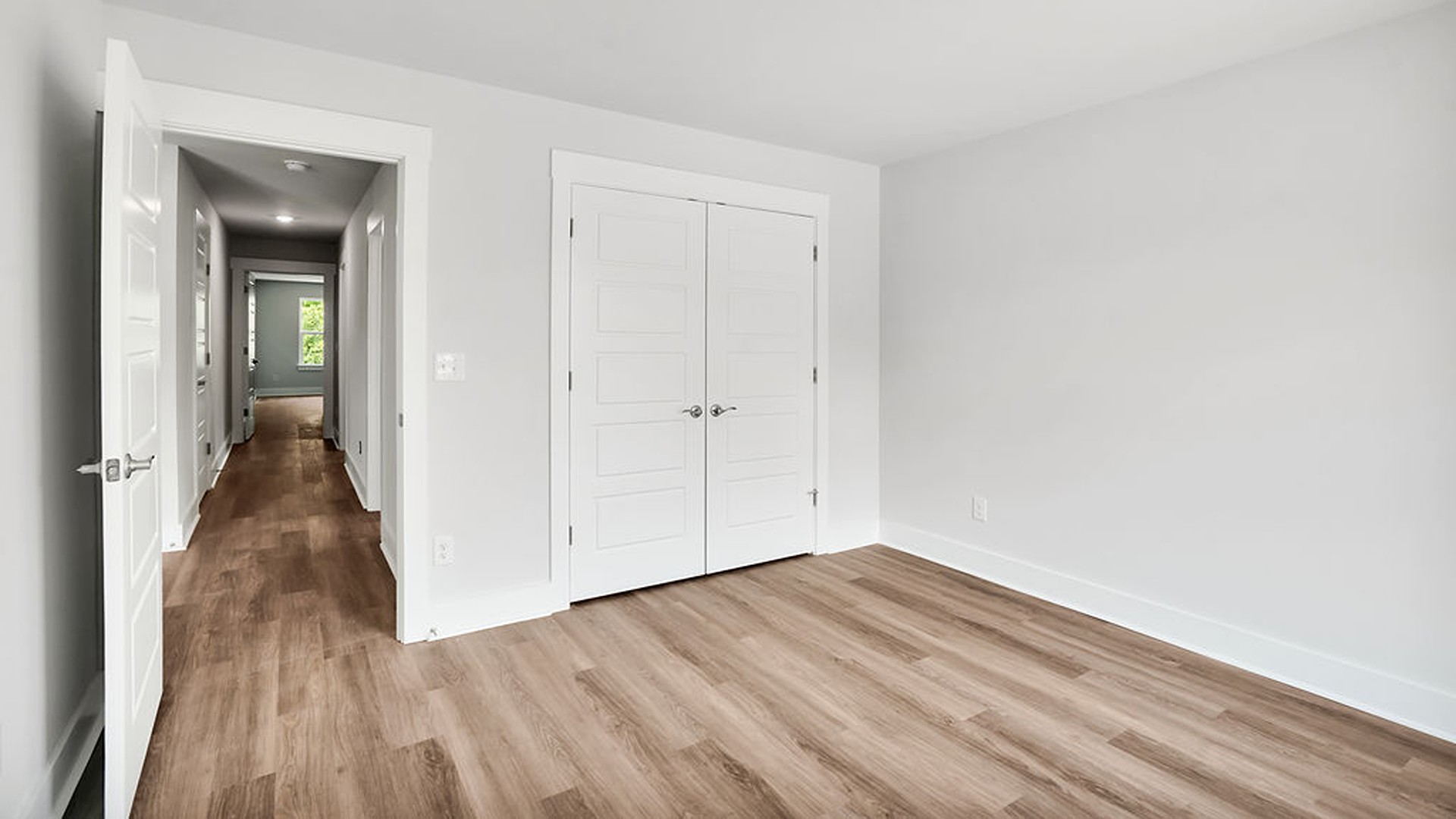The Guilford second story provides a private living area separate from the main floor, which includes a large upstairs living room, the Primary Bedroom suite, and three additional bedrooms with shared access to bathrooms and laundry facilities
