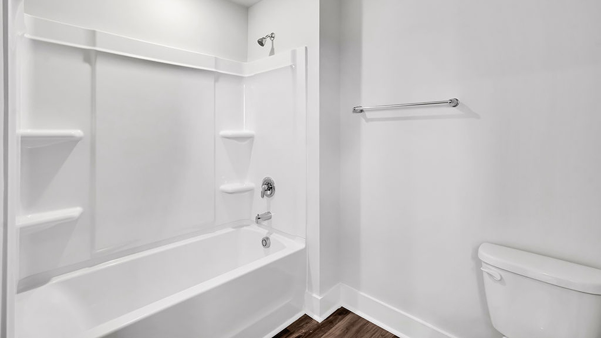 The Guilford second story provides a private living area separate from the main floor, which includes a large upstairs living room, the Primary Bedroom suite, and three additional bedrooms with shared access to bathrooms and laundry facilities
