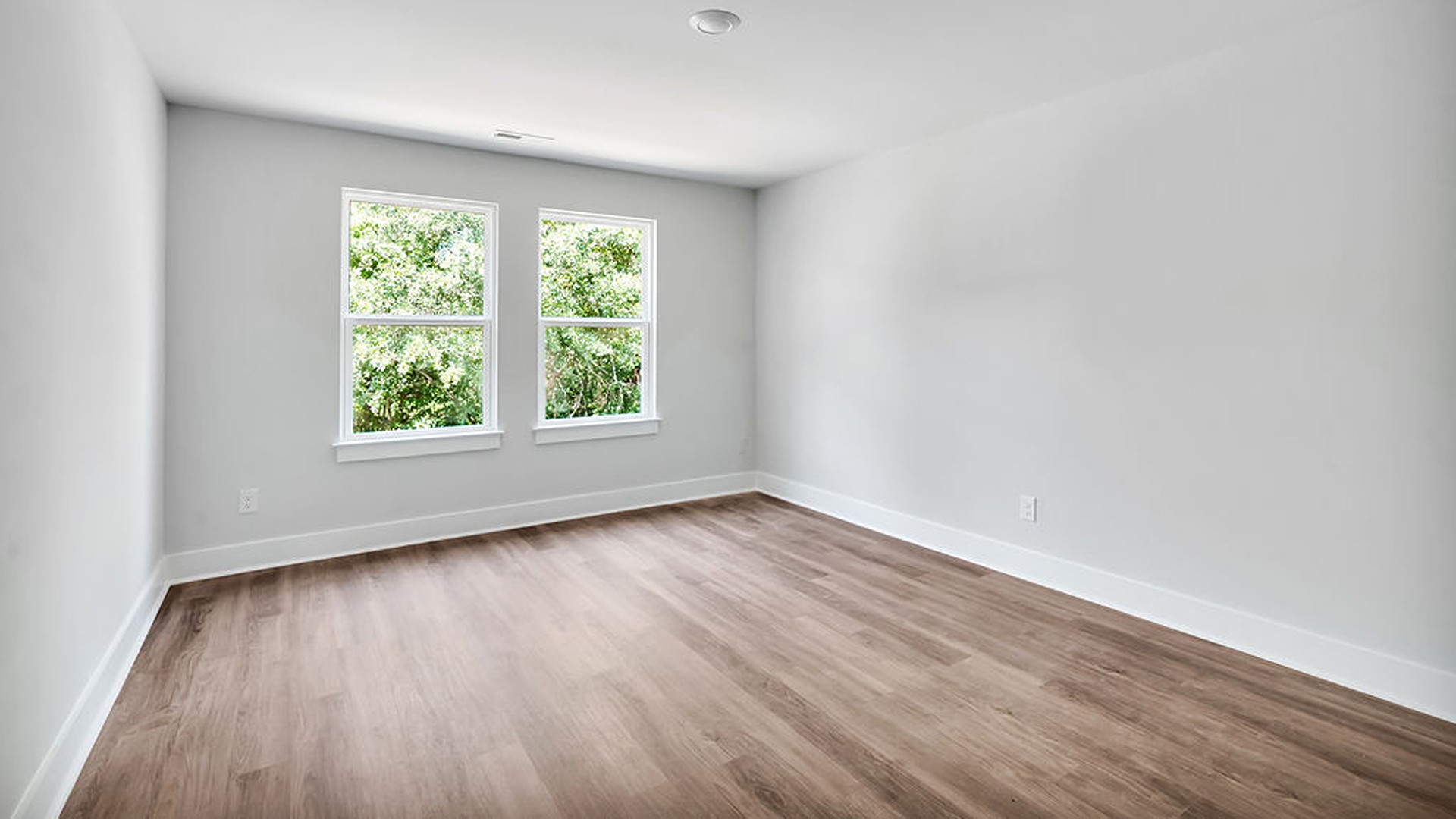 The Guilford second story provides a private living area separate from the main floor, which includes a large upstairs living room, the Primary Bedroom suite, and three additional bedrooms with shared access to bathrooms and laundry facilities