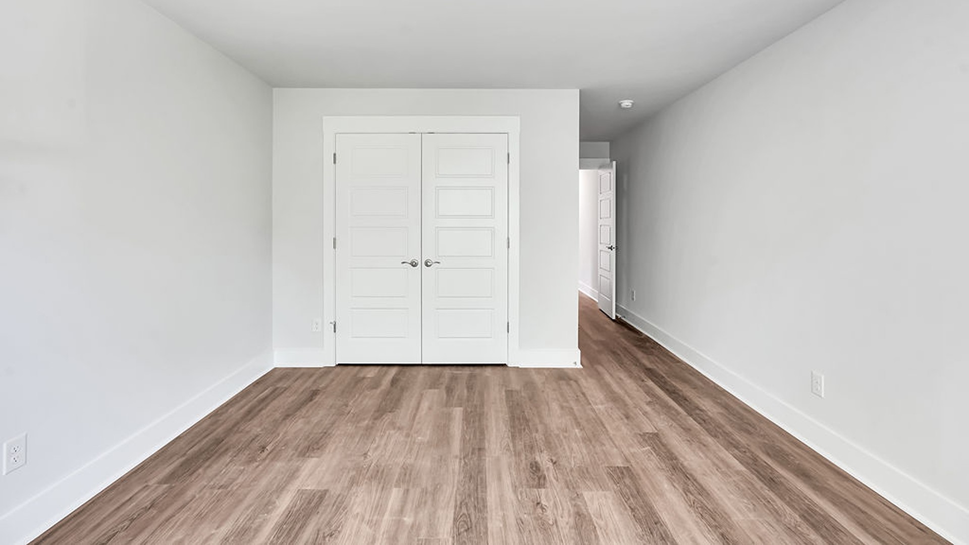 The Guilford second story provides a private living area separate from the main floor, which includes a large upstairs living room, the Primary Bedroom suite, and three additional bedrooms with shared access to bathrooms and laundry facilities