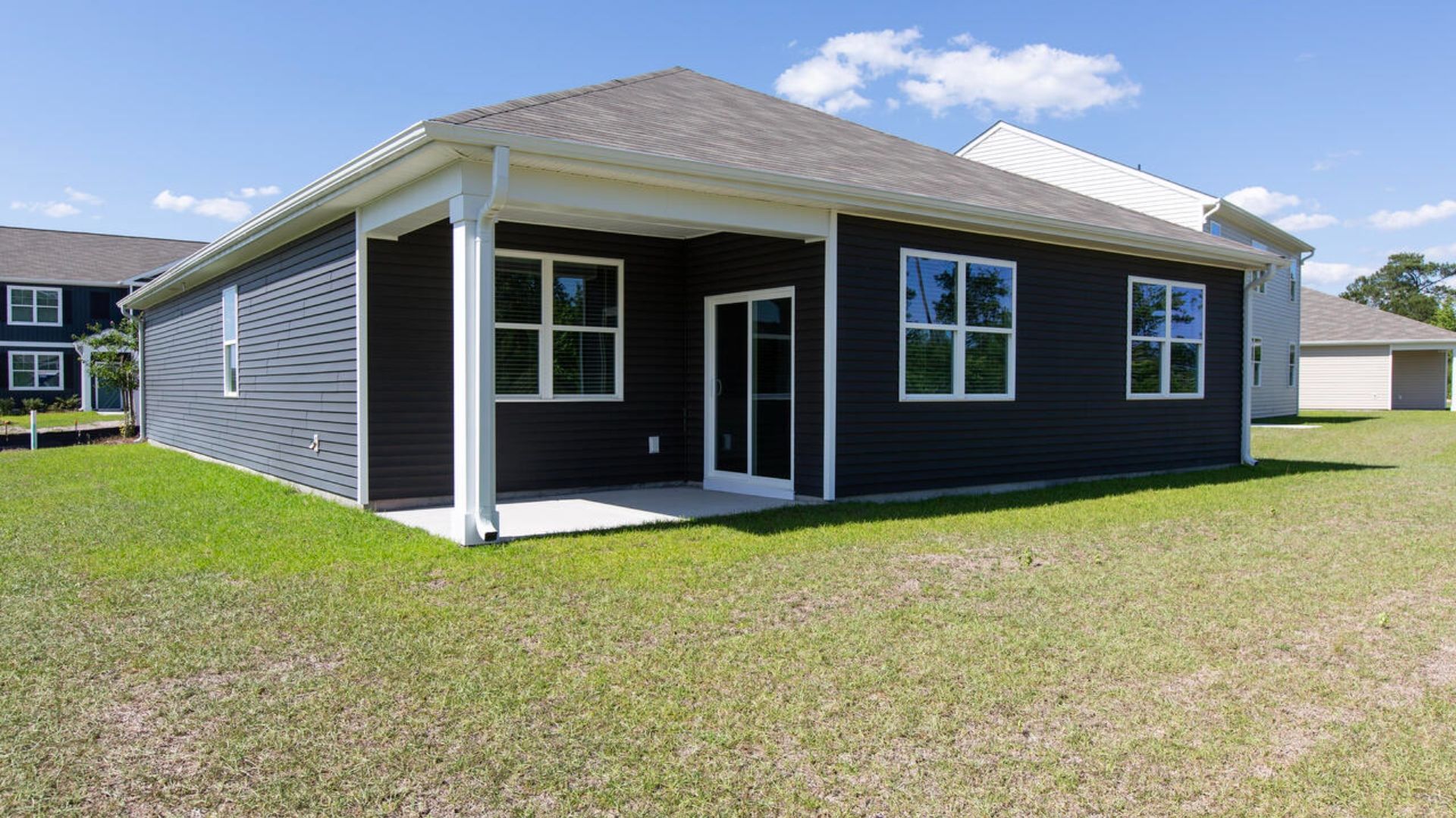 Step outside onto your covered porch to enjoy the night sky. With its open layout and sleek design, the Aria is ideal for anyone seeking comfort and modern features.