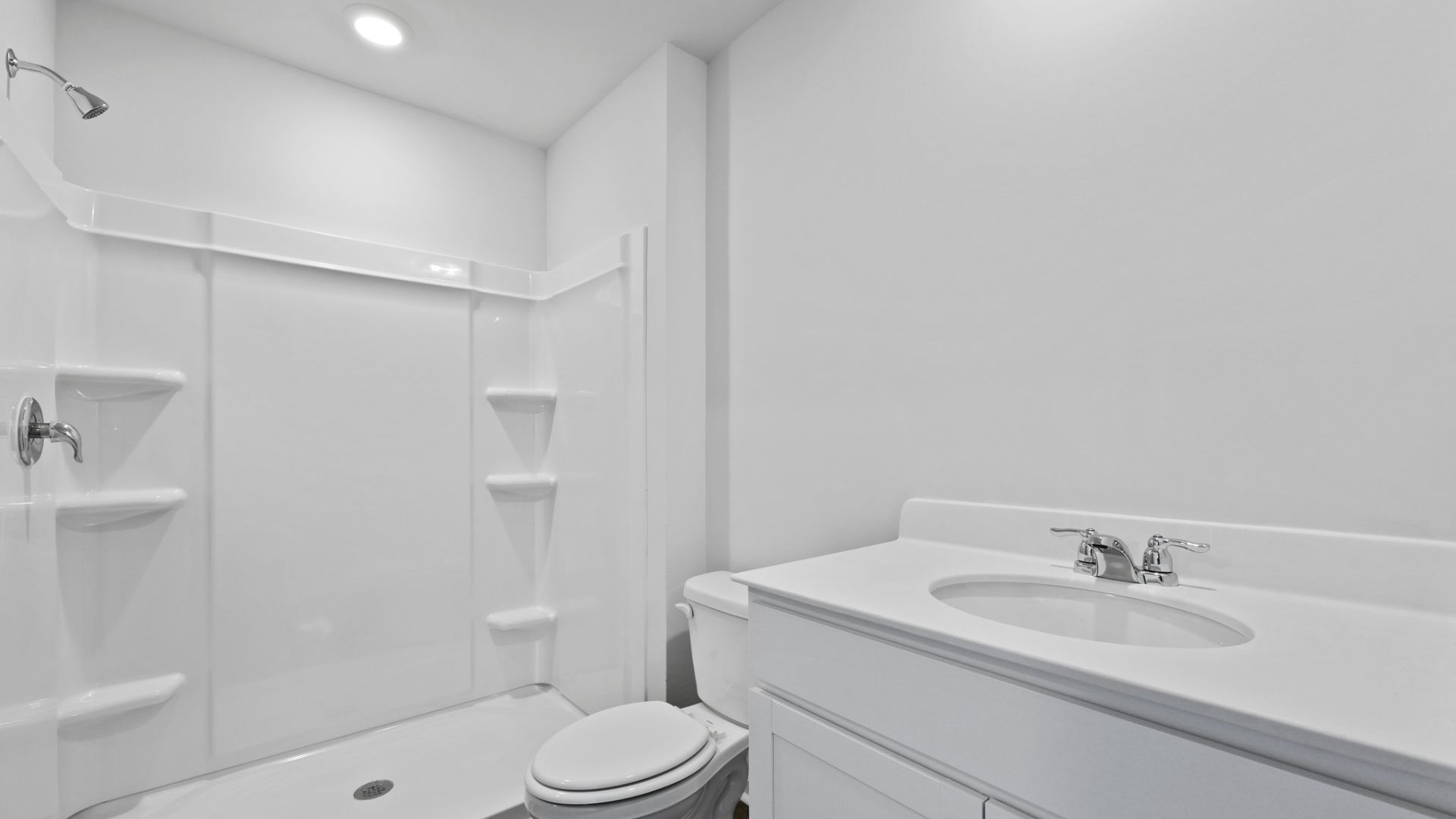 Bedroom One, located at the back of the house for privacy, also has a suite bathroom with double vanity and walk-in closet.