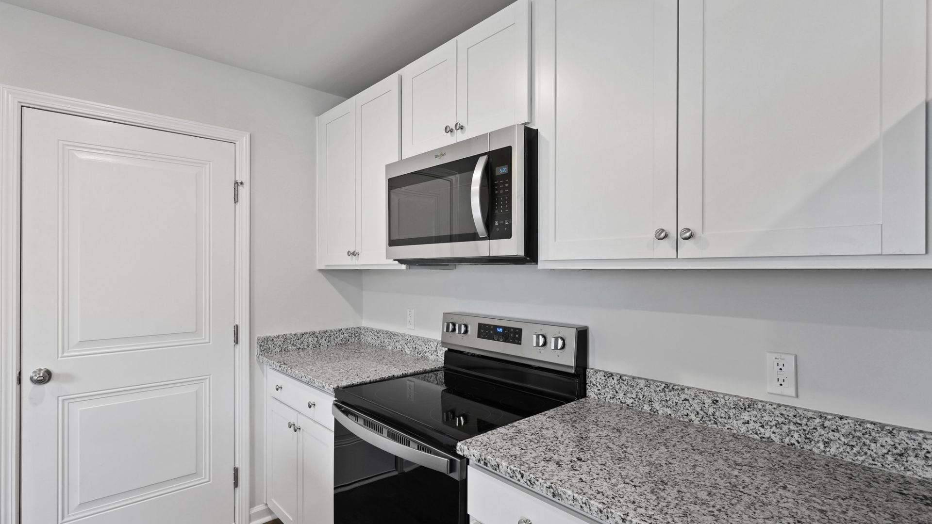 The kitchen features shaker-style cabinets, granite countertops, and stainless-steel appliances, which are sure to both turn heads and make meal prep easy. You’ll never be too far from the action with the living and dining area right there.  The primary bedroom has its own attached b