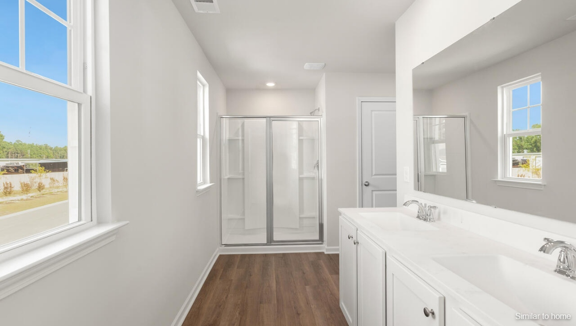 Designed for modern living, the main level features a flexible front room that can serve as a formal dining area, home office, or sitting room. The open-concept kitchen, dining and family room flow seamlessly together, perfect for entertaining and everyday living.