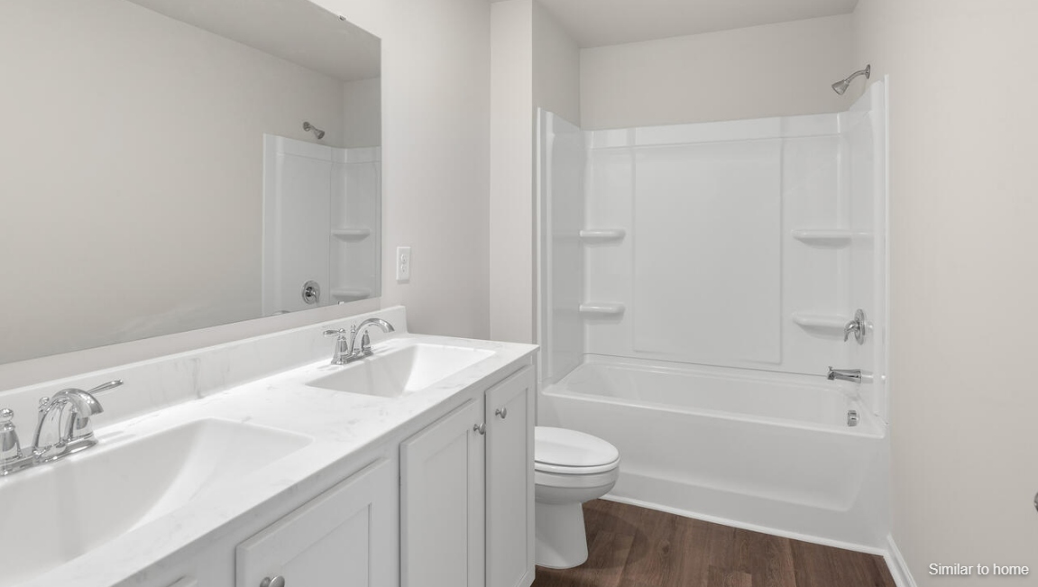 Three additional bedrooms, a full bathroom, and a convenient laundry room complete the second floor, offering plenty of space and versatility for your lifestyle.