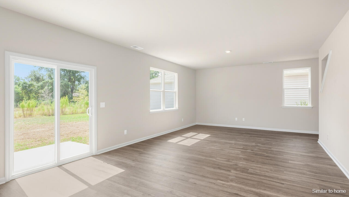 Designed for modern living, the main level features a flexible front room that can serve as a formal dining area, home office, or sitting room. The open-concept kitchen, dining and family room flow seamlessly together, perfect for entertaining and everyday living.