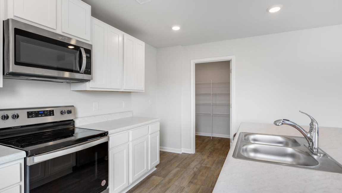 The open-concept kitchen, dining and family room flow seamlessly together, perfect for entertaining and everyday living.