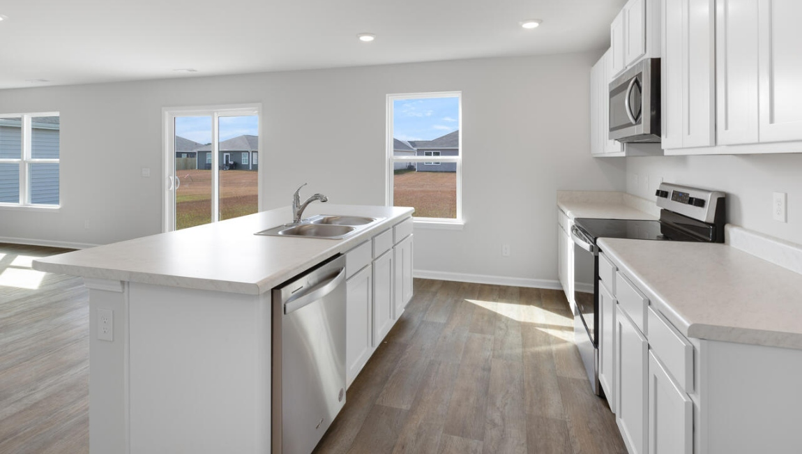 The open-concept kitchen, dining and family room flow seamlessly together, perfect for entertaining and everyday living.