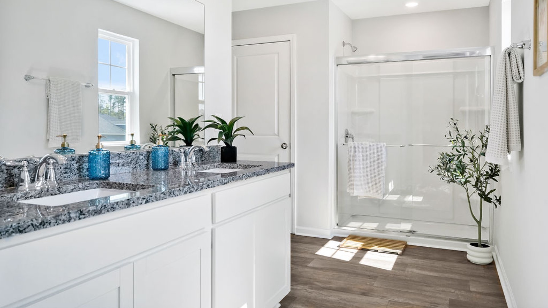 Upstairs, the Primary Suite offers a private bathroom, and the rest of the second floor includes three additional bedrooms and a convenient laundry room. With its spacious layout and modern amenities, the Galen is perfect for those seeking a versatile and functional home.