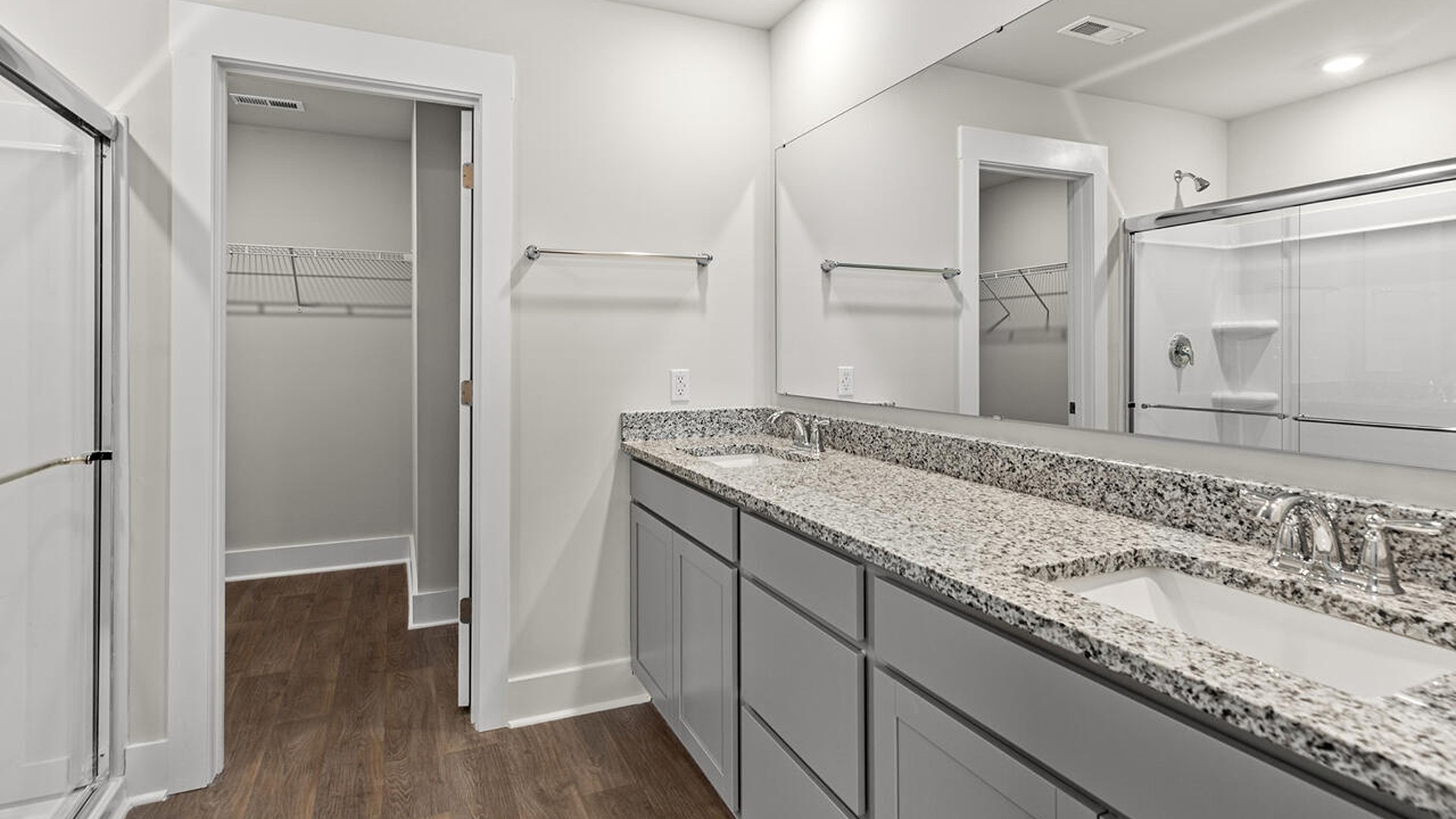 The primary bedroom is on the first floor and has its own attached bathroom that features a walk-in closet and all the space you need to get ready in the morning.