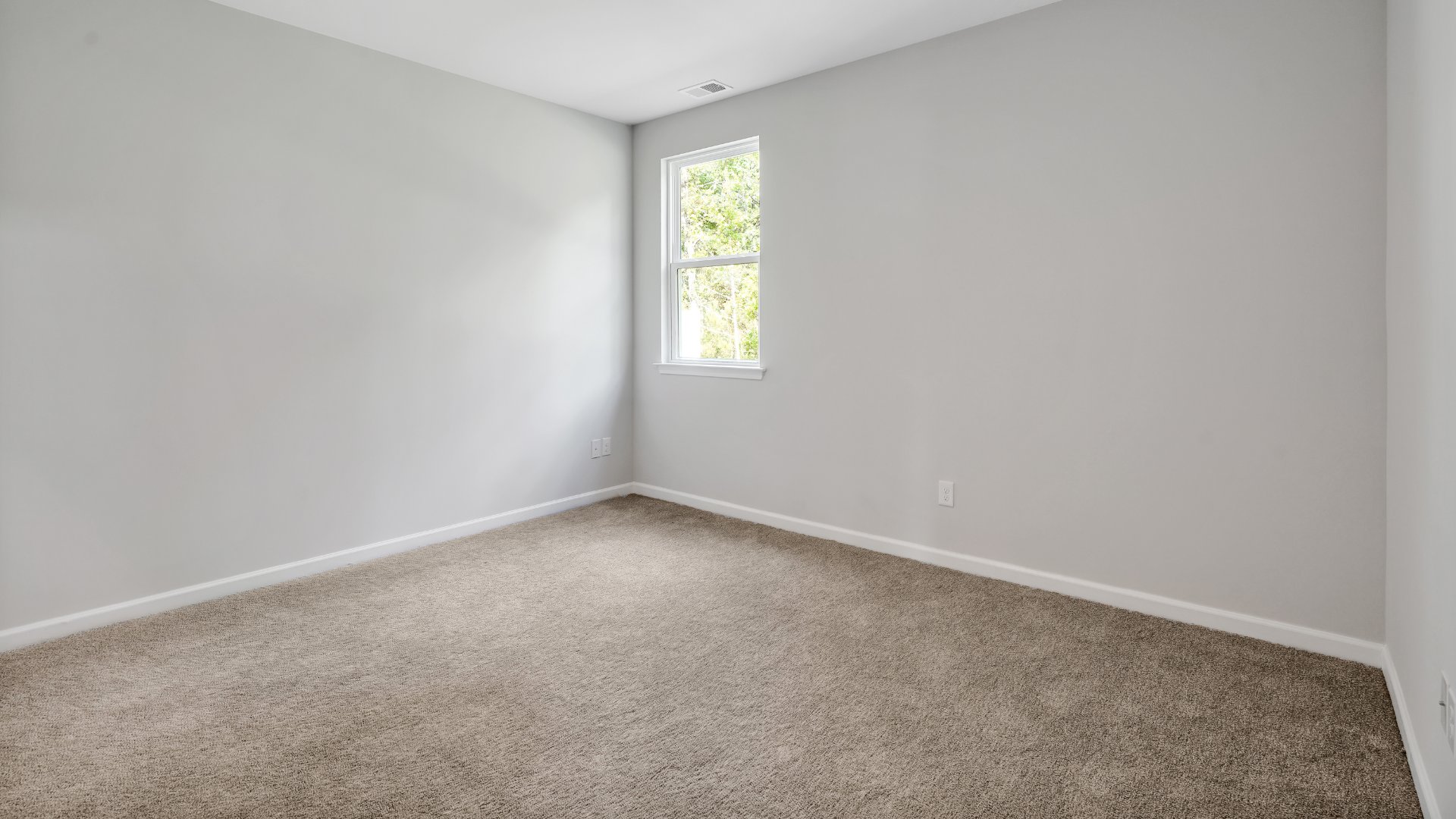 The primary bedroom is on the first floor and has its own attached bathroom that features a walk-in closet and all the space you need to get ready in the morning.