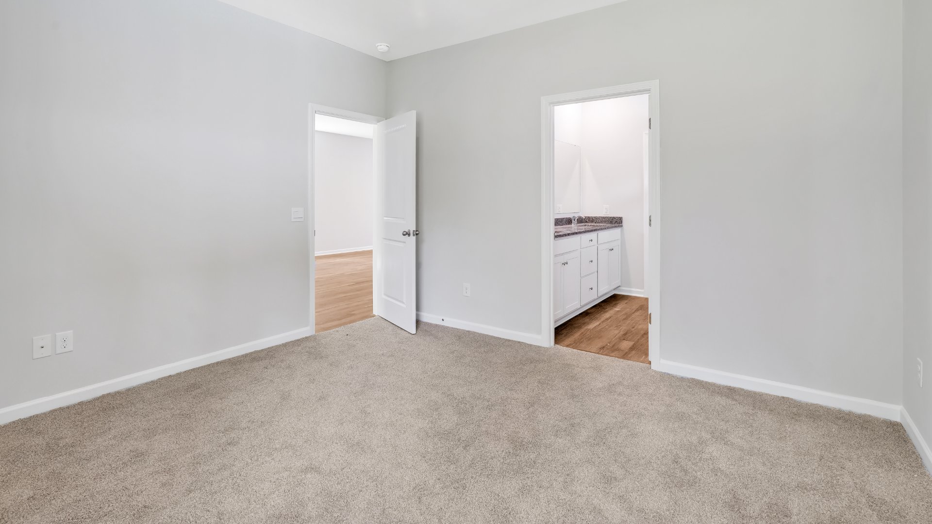 The primary bedroom is on the first floor and has its own attached bathroom that features a walk-in closet and all the space you need to get ready in the morning.