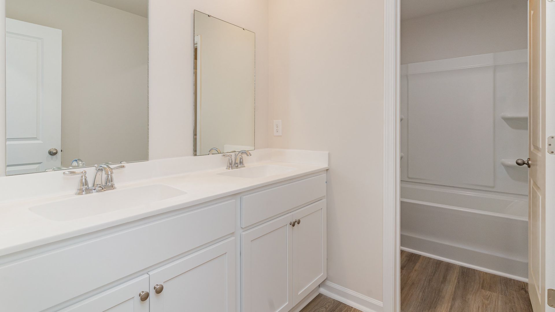 The primary bedroom has its own attached bathroom that features a walk-in closet and all the space you need to get ready in the morning. Sharing a sink isn’t a worry with the double vanity, and you also get additional privacy with a separate door for the toilet and shower.