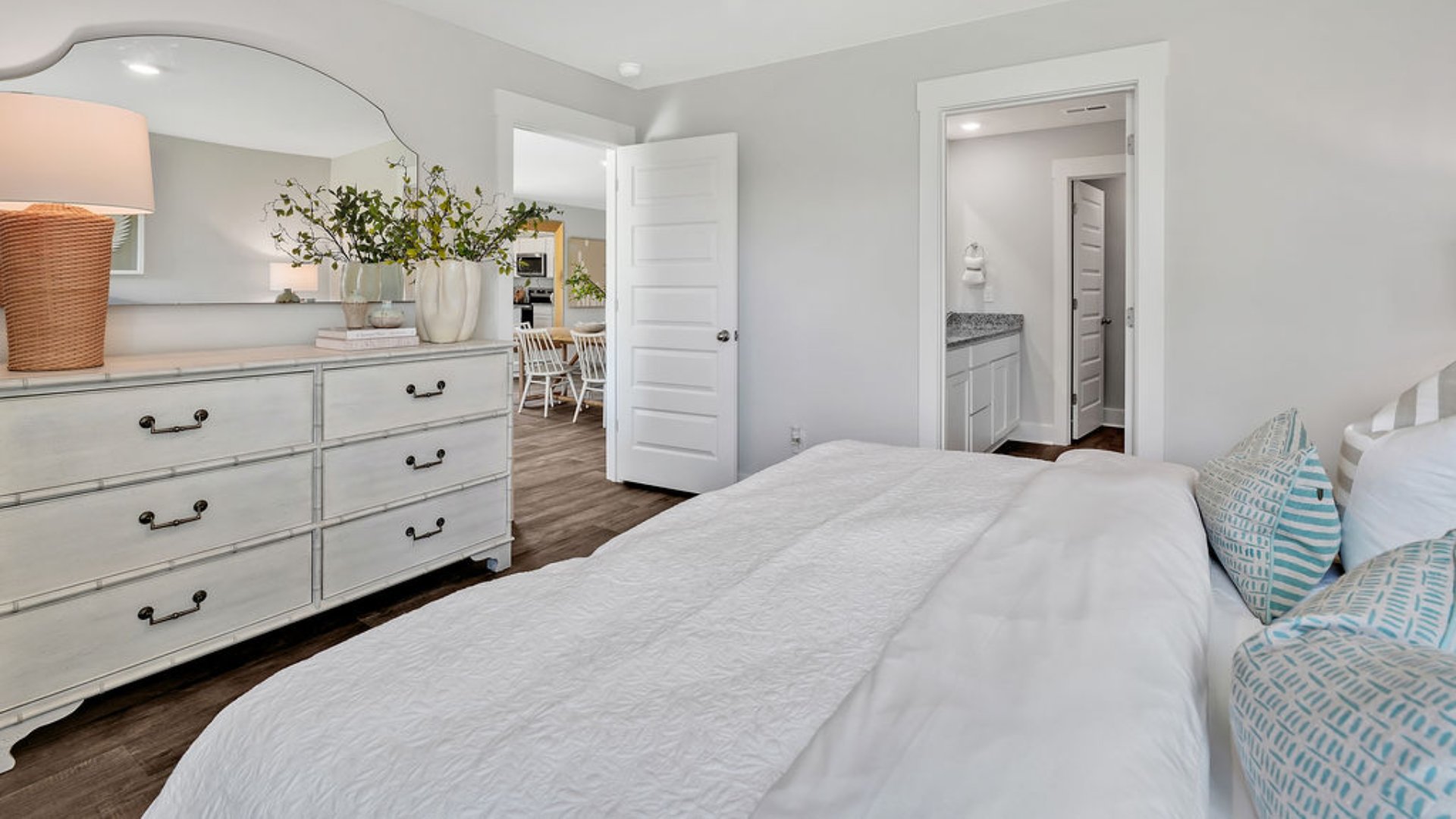 The primary bedroom is on the first floor and has its own attached bathroom that features a walk-in closet and all the space you need to get ready in the morning. Sharing a sink isn’t a worry with the double vanity, and you also get additional privacy with a separate door for the toilet and shower.