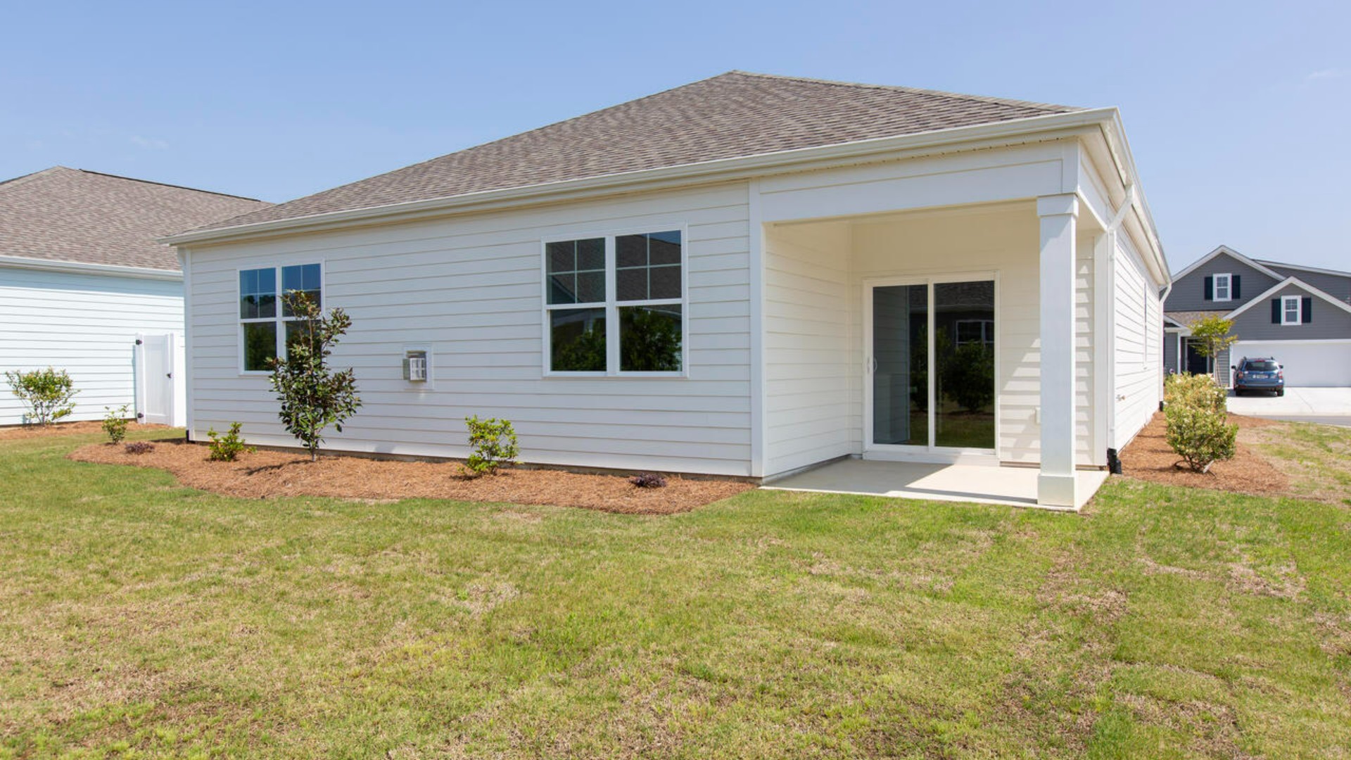 4 panel glass sliding doors open onto large covered porch a perfect spot to start the day or end the evening.