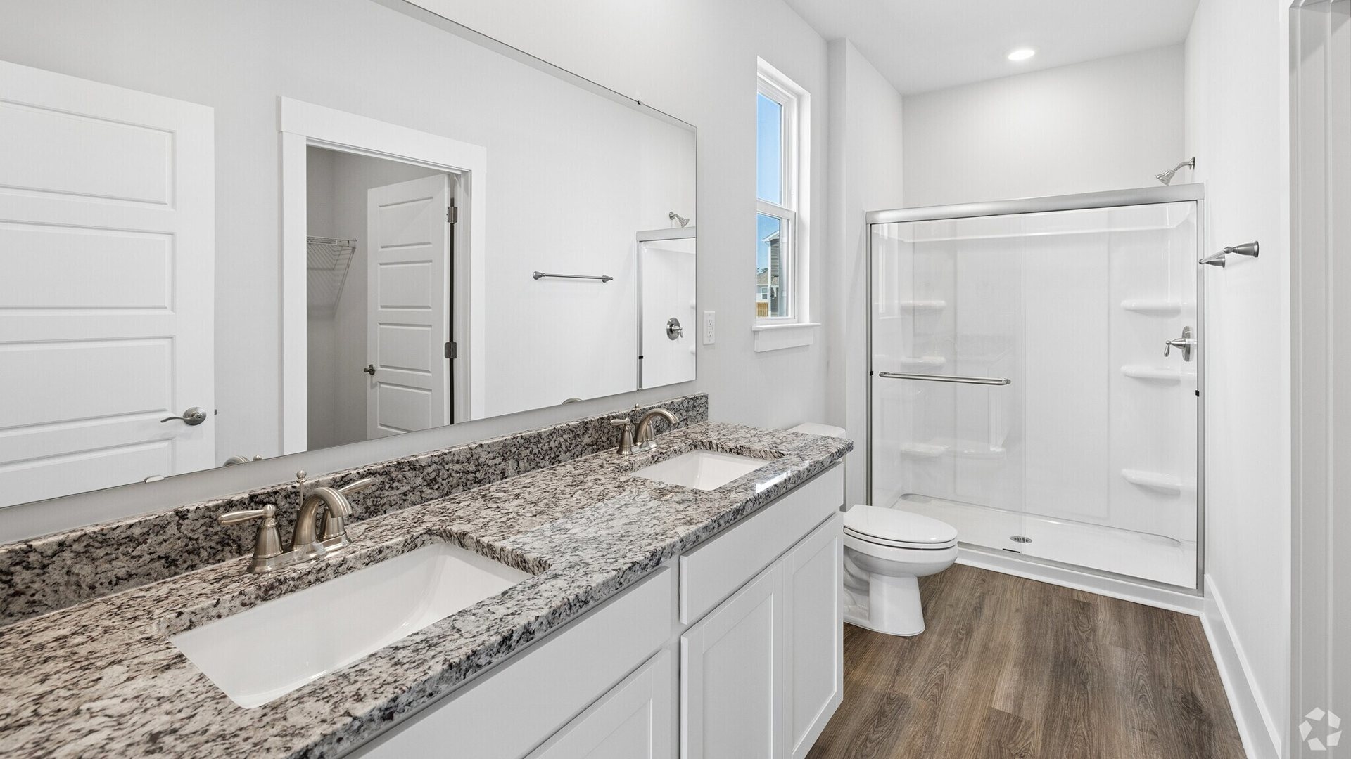 The primary bedroom has its own attached bathroom that features a walk-in closet and all the space you need to get ready in the morning.