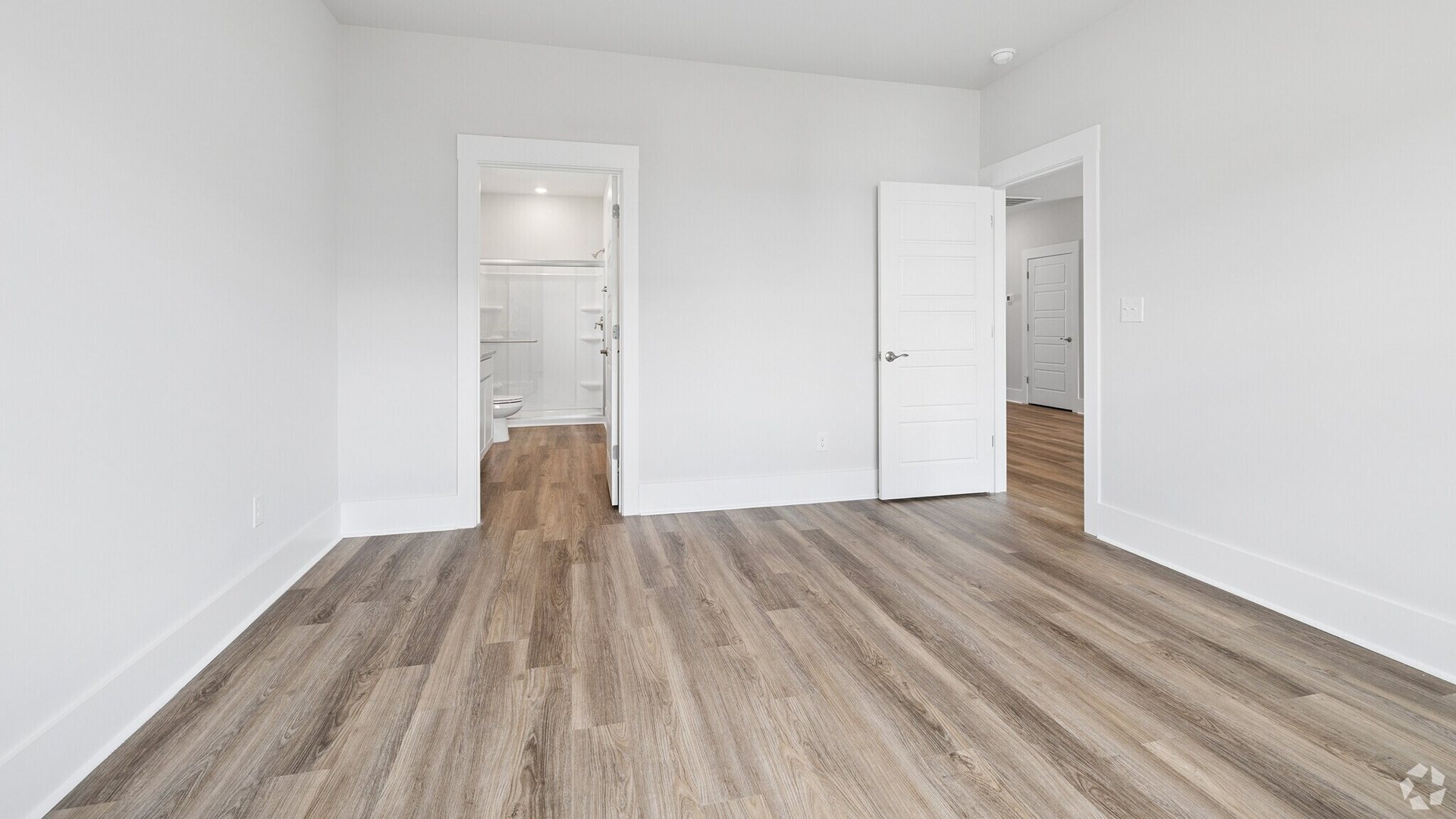 The primary bedroom has its own attached bathroom that features a walk-in closet and all the space you need to get ready in the morning.