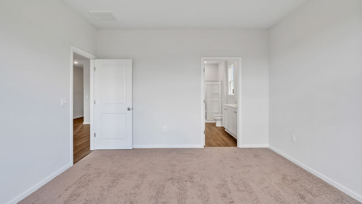 The primary bedroom has its own attached bathroom that features a walk-in closet and all the space you need to get ready in the morning.