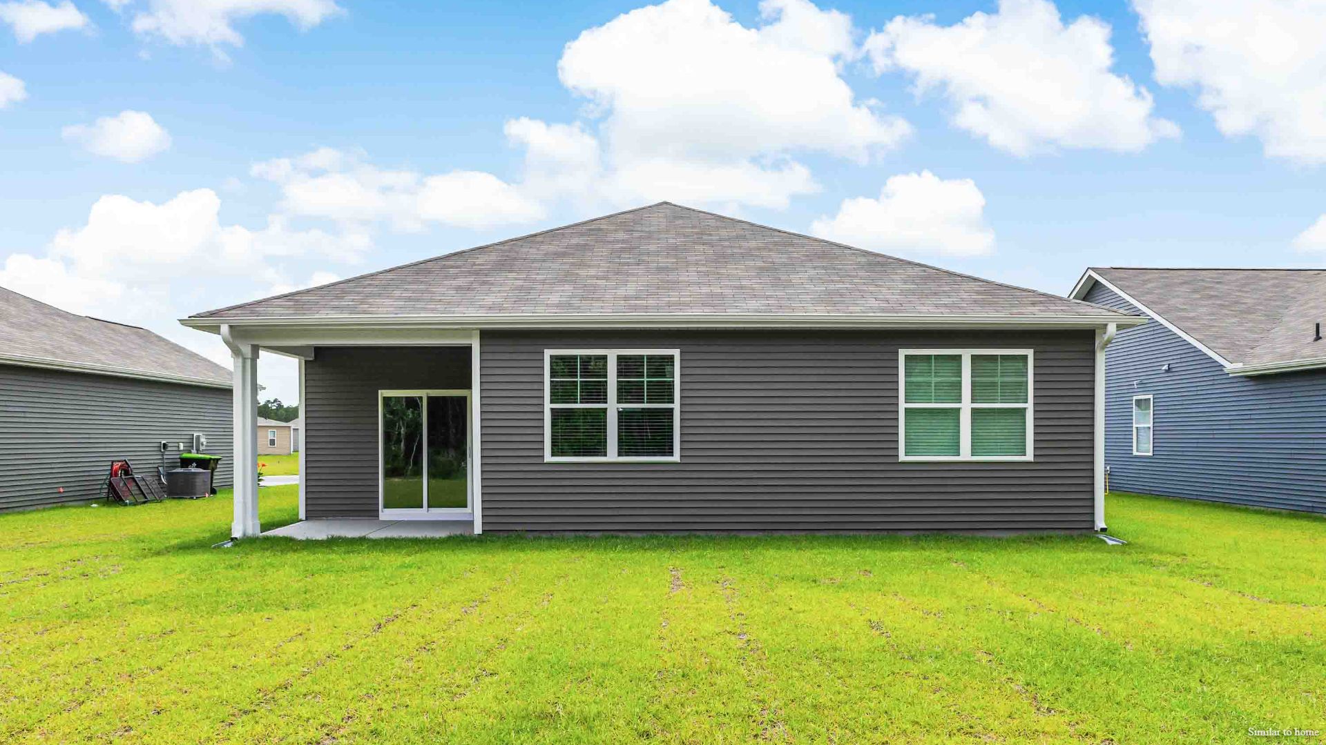 4 panel glass sliding doors open onto large covered porch a perfect spot to start the day or end the evening.