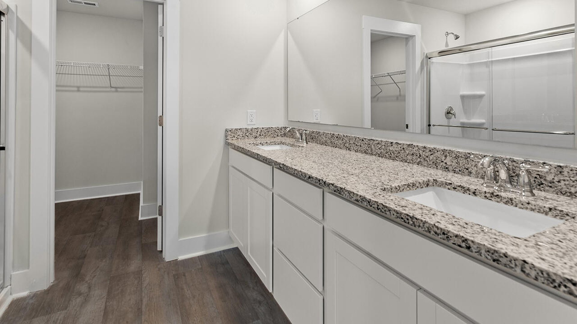 The primary bedroom is on the first floor and has its own attached bathroom that features a walk-in closet and all the space you need to get ready in the morning.