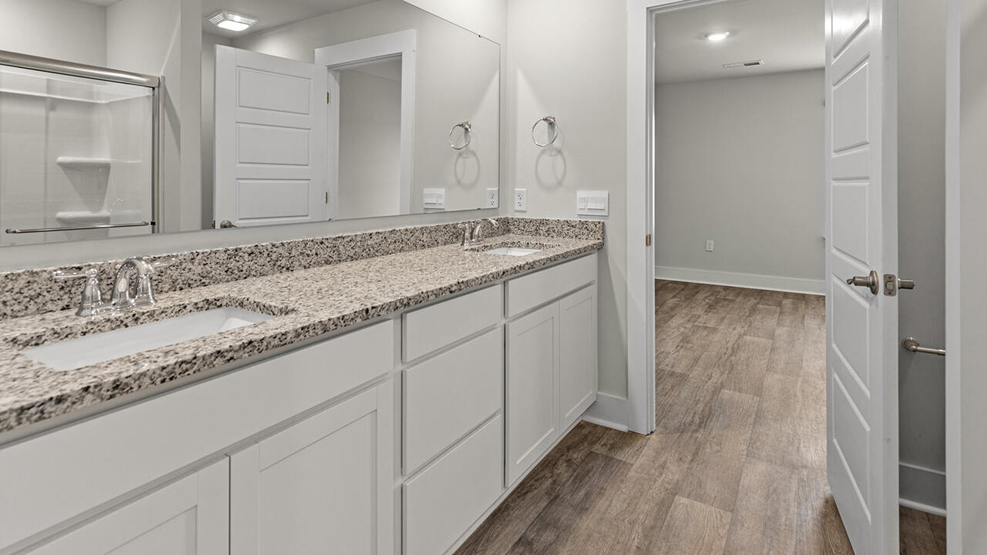 The primary bedroom is on the first floor and has its own attached bathroom that features a walk-in closet and all the space you need to get ready in the morning.
