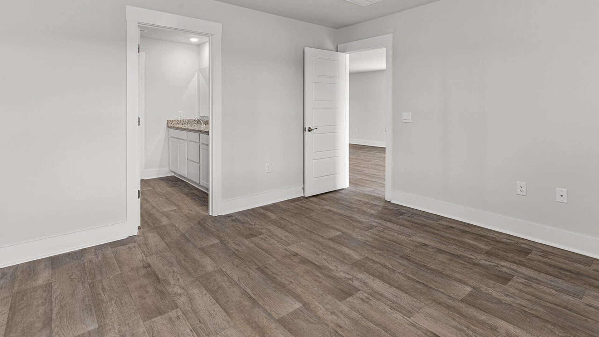 The primary bedroom is on the first floor and has its own attached bathroom that features a walk-in closet and all the space you need to get ready in the morning.