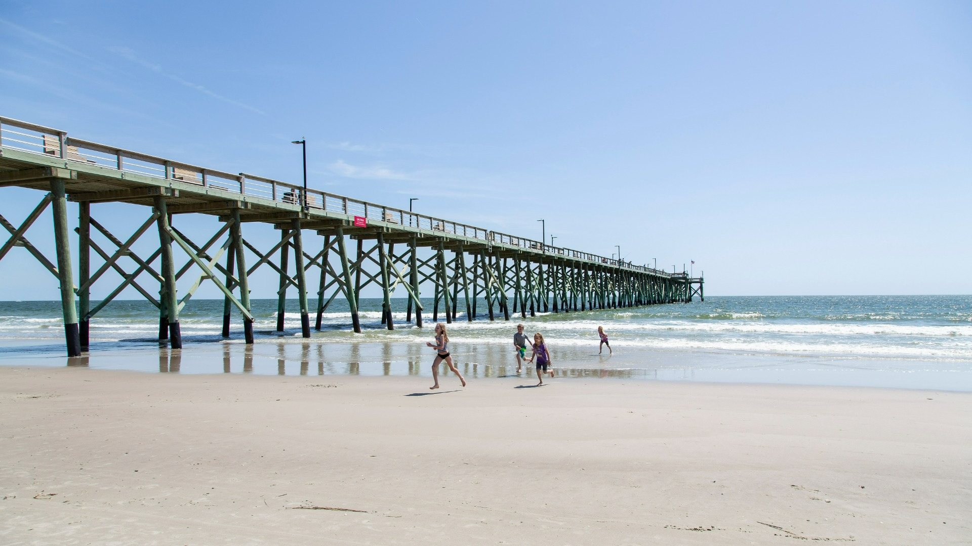 Renowned for its stunning beaches, the region is a haven for water sports enthusiasts. Boaters can reach Sunset Harbor Boat Ramp in just 15 minutes. Golfers have access to numerous world-class courses and resorts. Beach lovers are in for a treat with quick drives to the finest beaches in Brunswick County like Oak Island, Holden Beach, and Ocean Isle in North Carolina, as well as Cherry Grove and North Myrtle Beach in South Carolina. Nearby Southport boasts a variety of retail and dining options, both big brands and local favorites