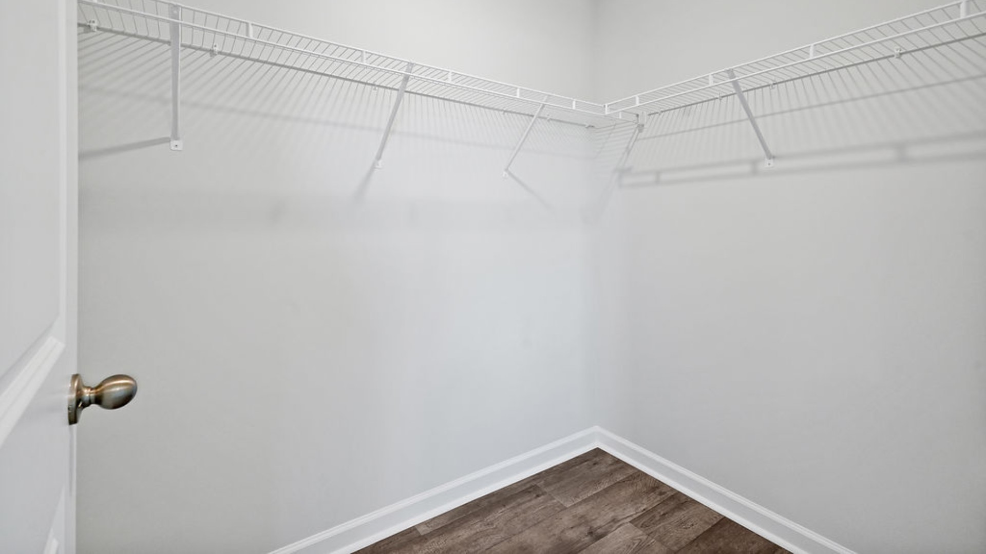 t the back, the Primary Suite provides privacy with a large walk-in closet and walk-in shower. In every bedroom you’ll have vinyl flooring and a closet in each room.