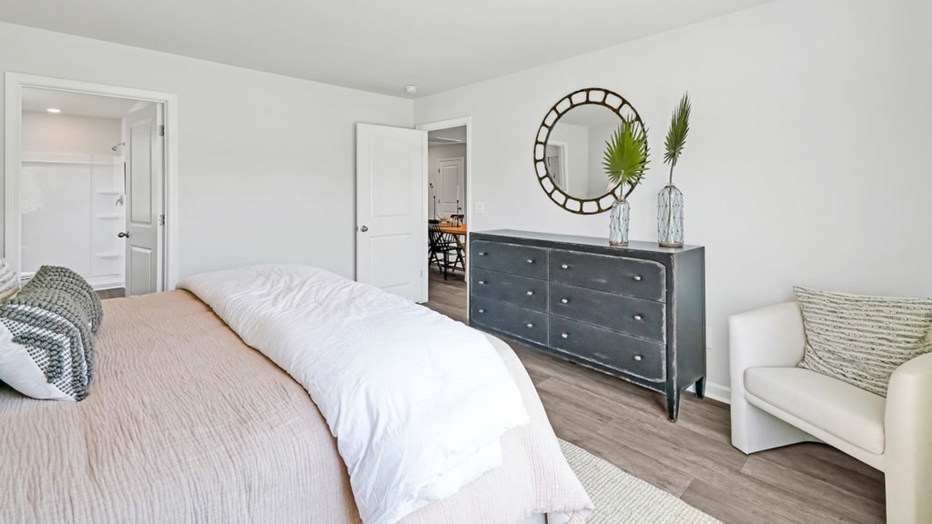 At the back, the Primary Suite provides privacy with a large walk-in closet and walk-in shower.