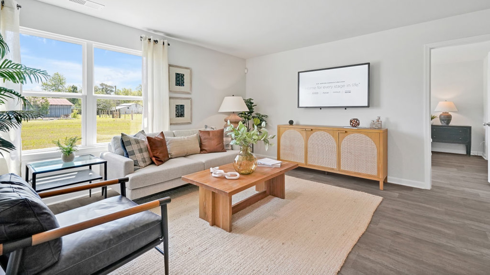 The open-concept family room, kitchen, and dining area