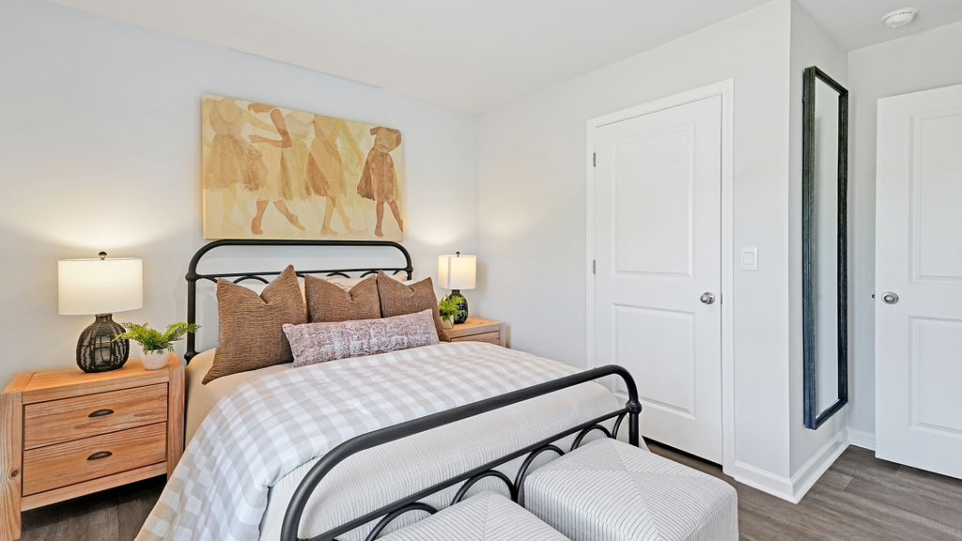 At the front are two guest bedrooms and a full bathroom, perfect for visitors or a home office