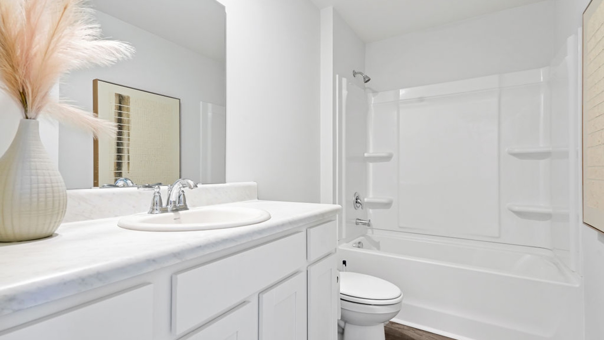 At the front are two guest bedrooms and a full bathroom, perfect for visitors or a home office