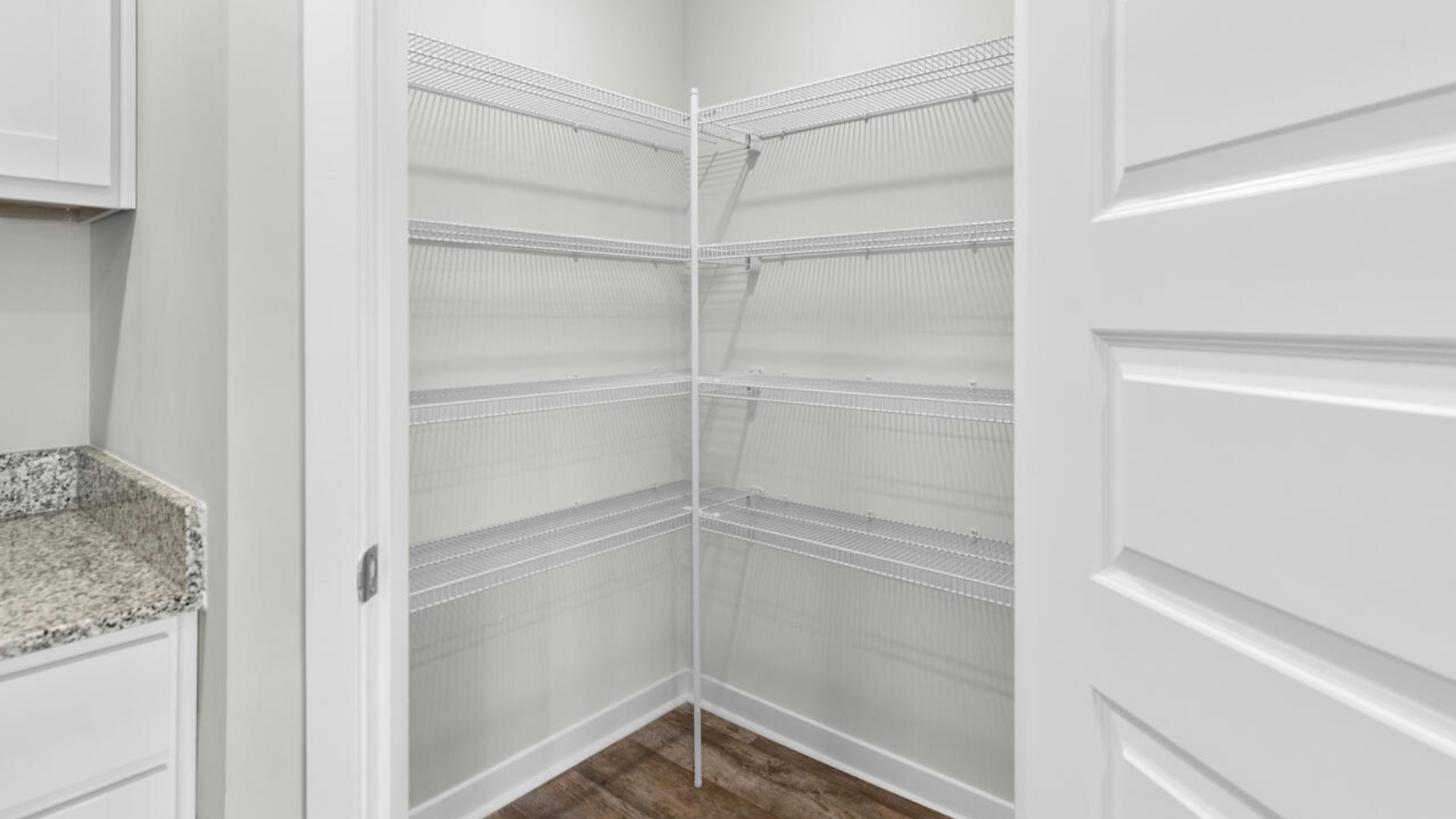 The kitchen features a large island, laminate countertops, and stainless steel appliances, which are sure to both turn heads and make meal prep easy. You’ll never be too far from the action with the living and dining area right there.