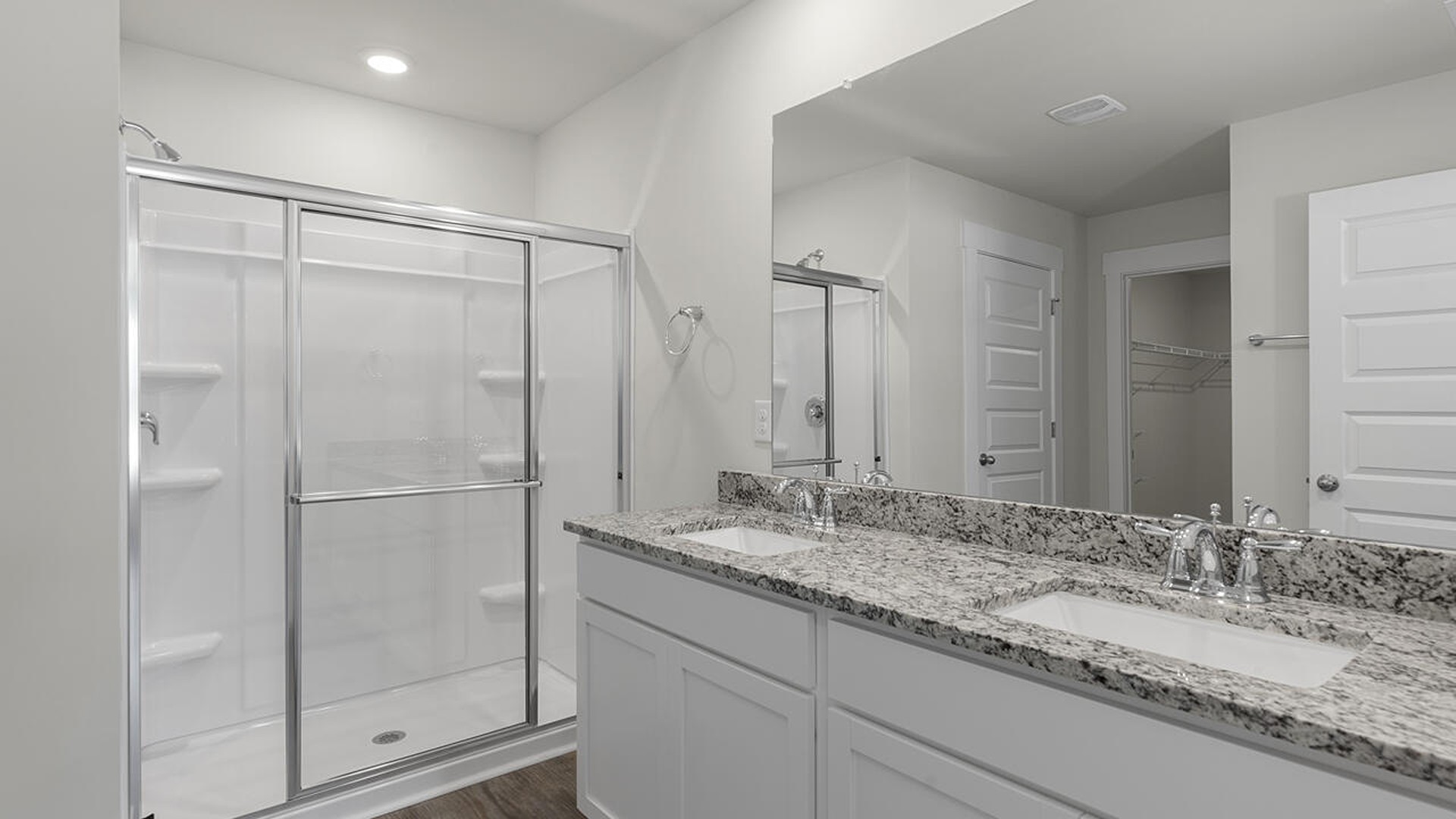 The primary bedroom has its own attached bathroom that features a walk-in closet and all the space you need to get ready in the morning.