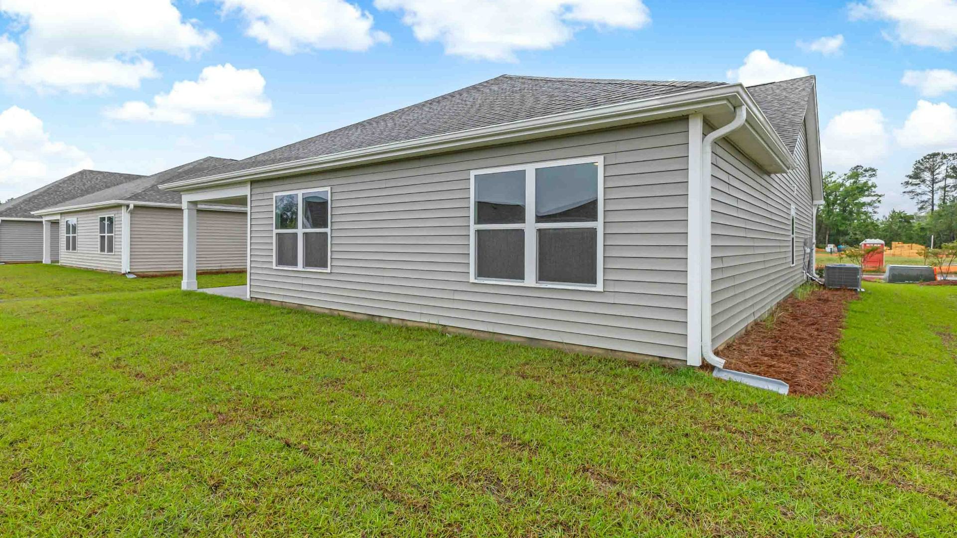 Enjoy the covered porch perfect for entertaining and enjoying the Carolina evenings