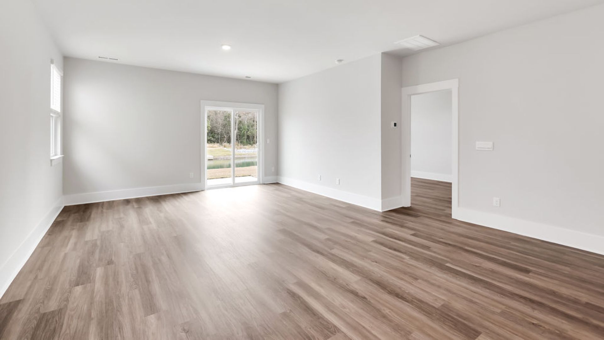 Entering the great room, we find the dining area, family room and a wonderful cook's kitchen are all together for open living. Downstairs, there is a half bath.