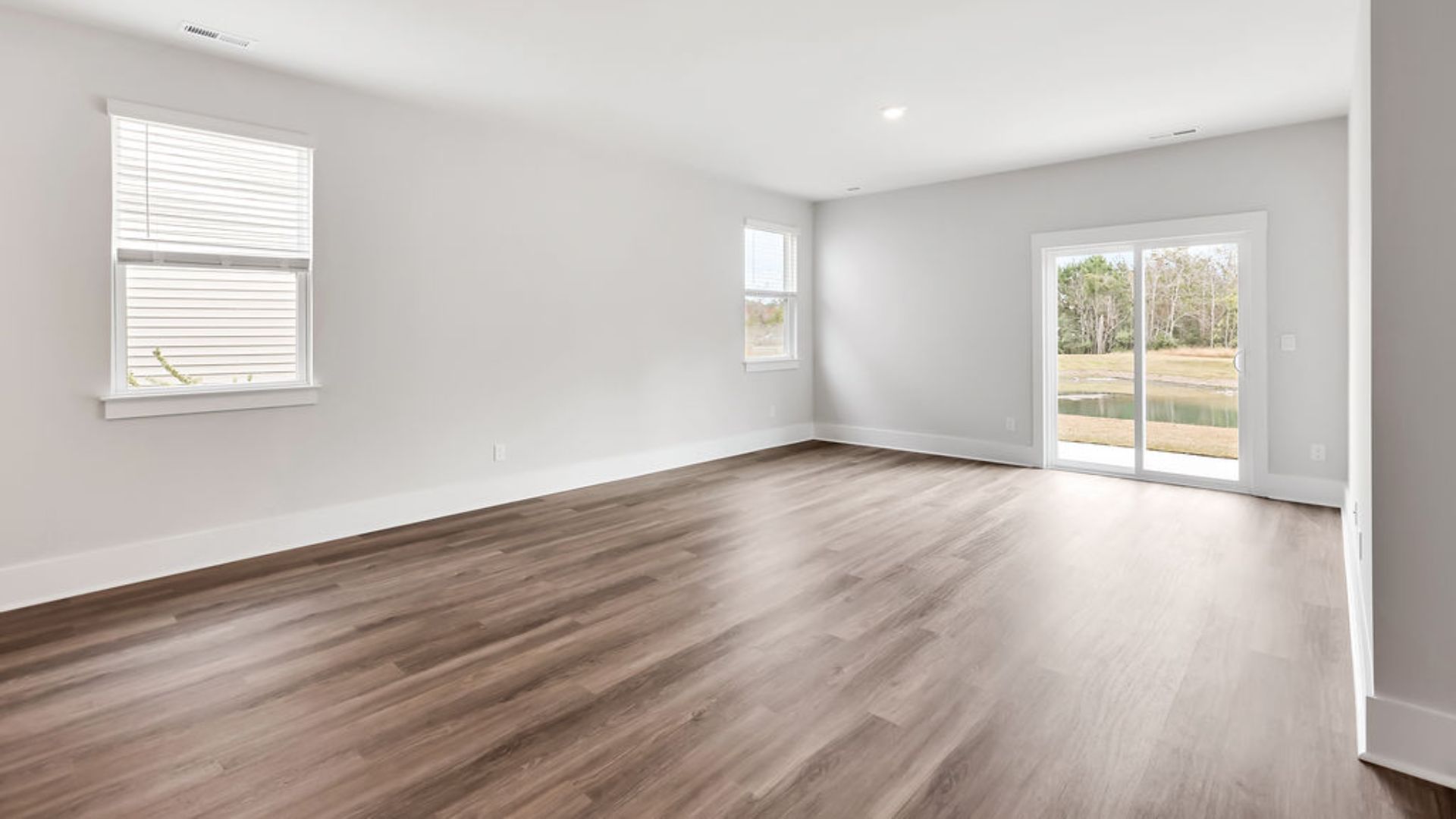 Entering the great room, we find the dining area, family room and a wonderful cook's kitchen are all together for open living. Downstairs, there is a half bath.