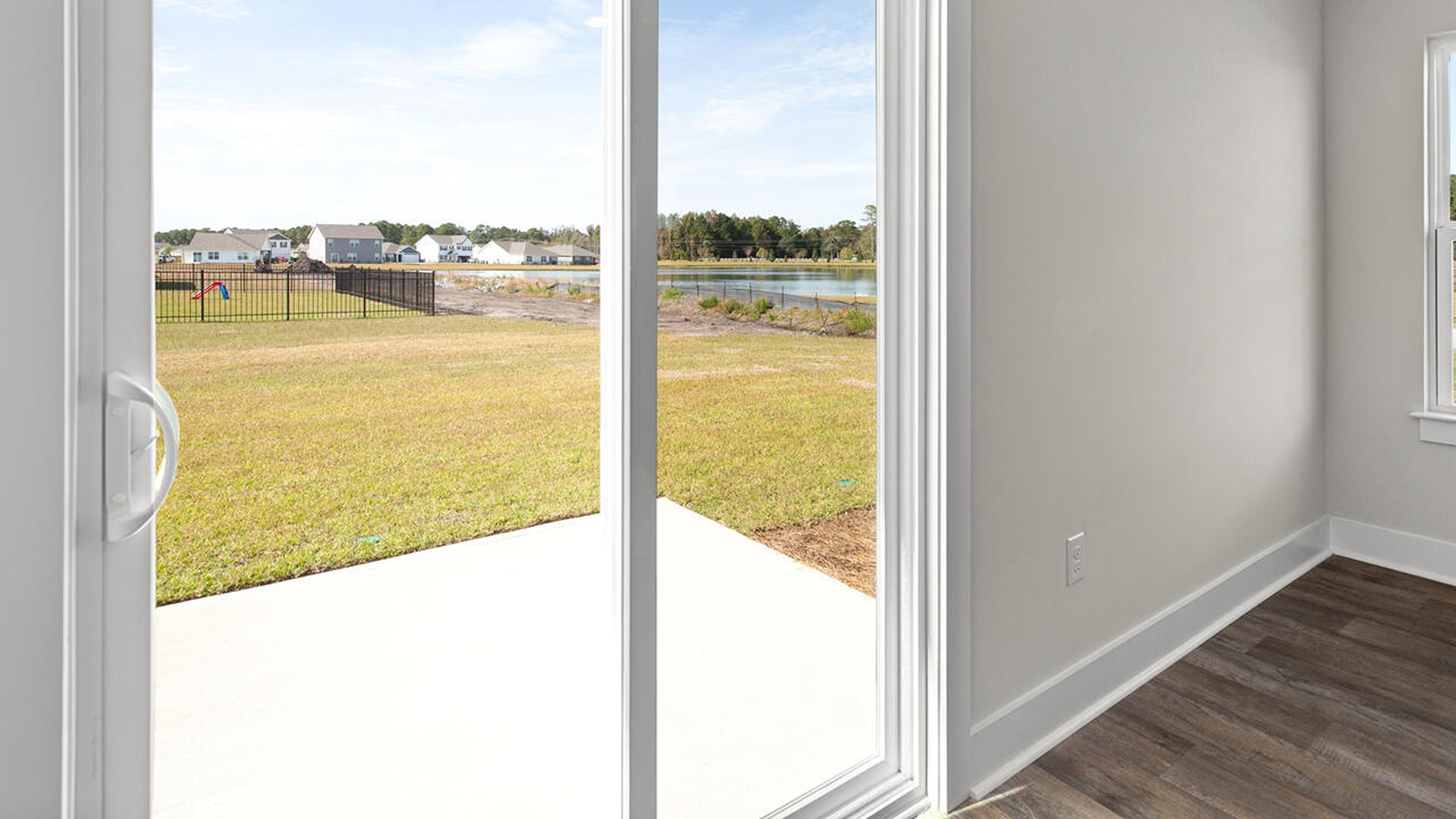 The  primary suite on the main level. Entering the great room we find the dining area, family room and a wonderful cook's kitchen are all together for open living