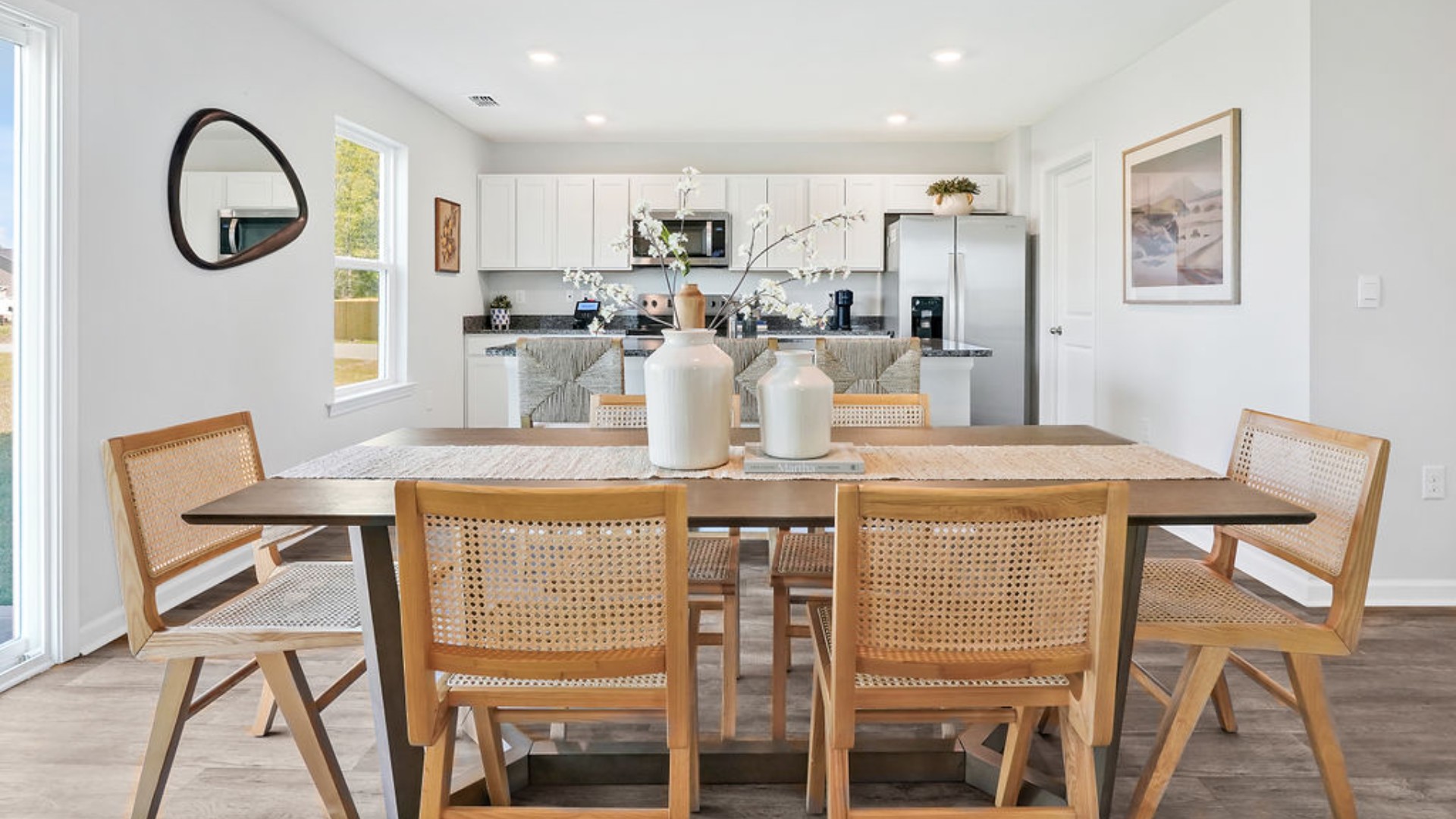 The open-concept kitchen, dining, and family room flow seamlessly together