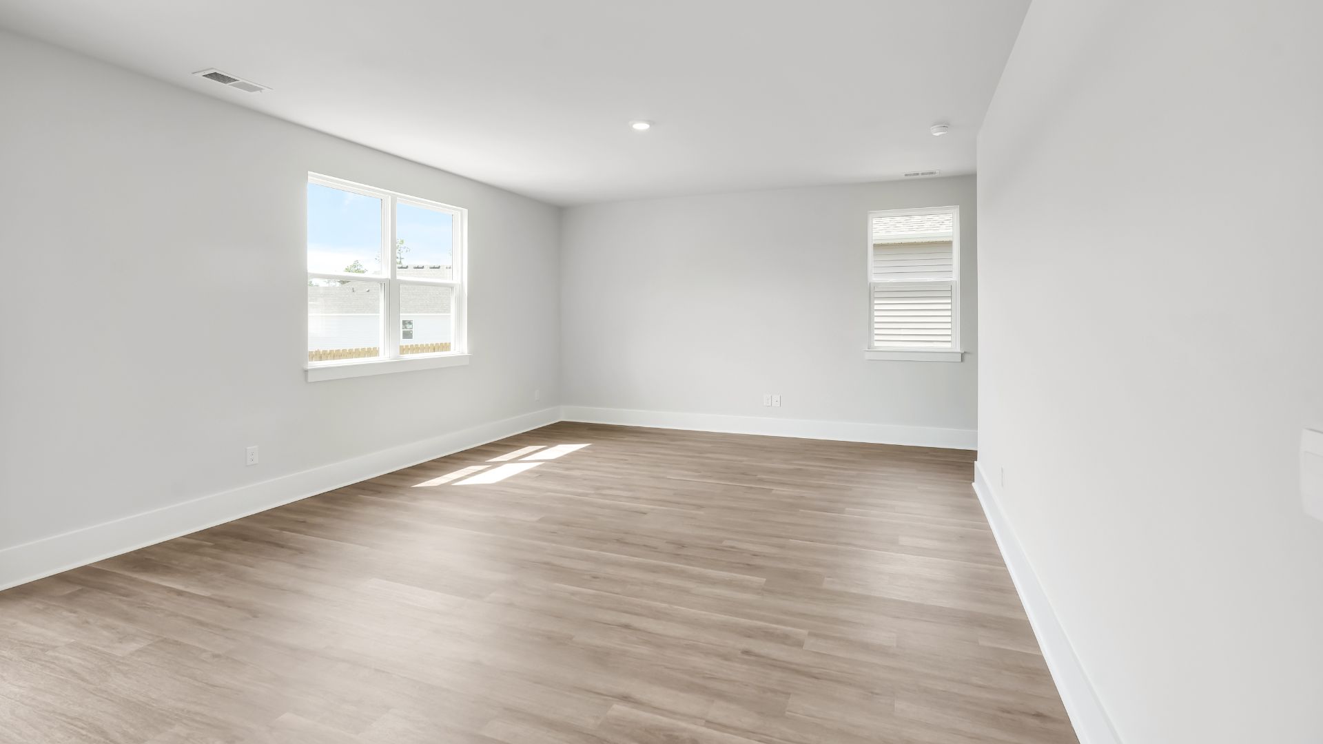 The kitchen features a large island and stainless-steel appliances, which are sure to both turn heads and make meal prep easy. You’ll never be too far from the action with the living and dining area right there.