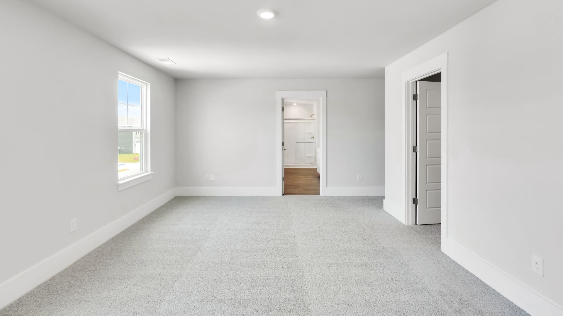The primary bedroom has its own attached bathroom that features a walk-in closet and all the space you need to get ready in the morning.