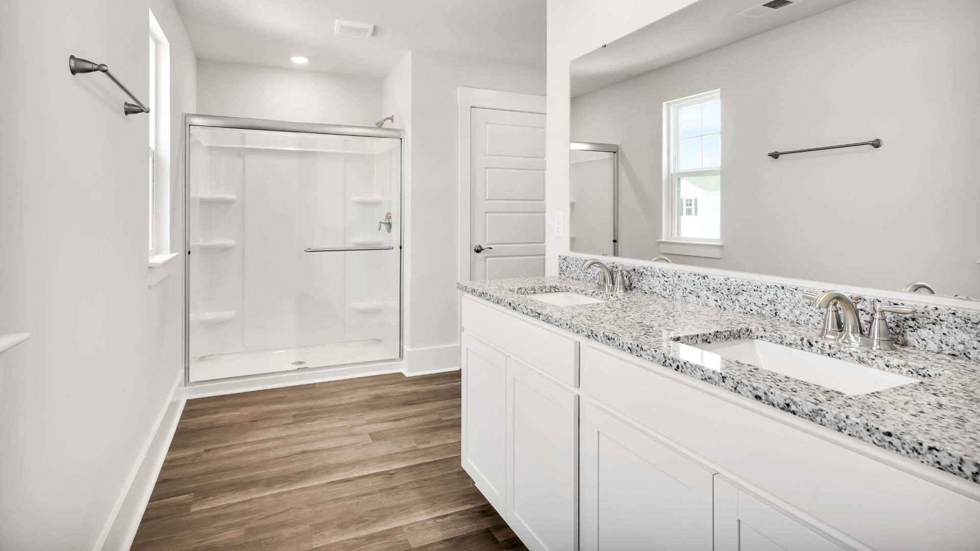 The primary bedroom has its own attached bathroom that features a walk-in closet and all the space you need to get ready in the morning.