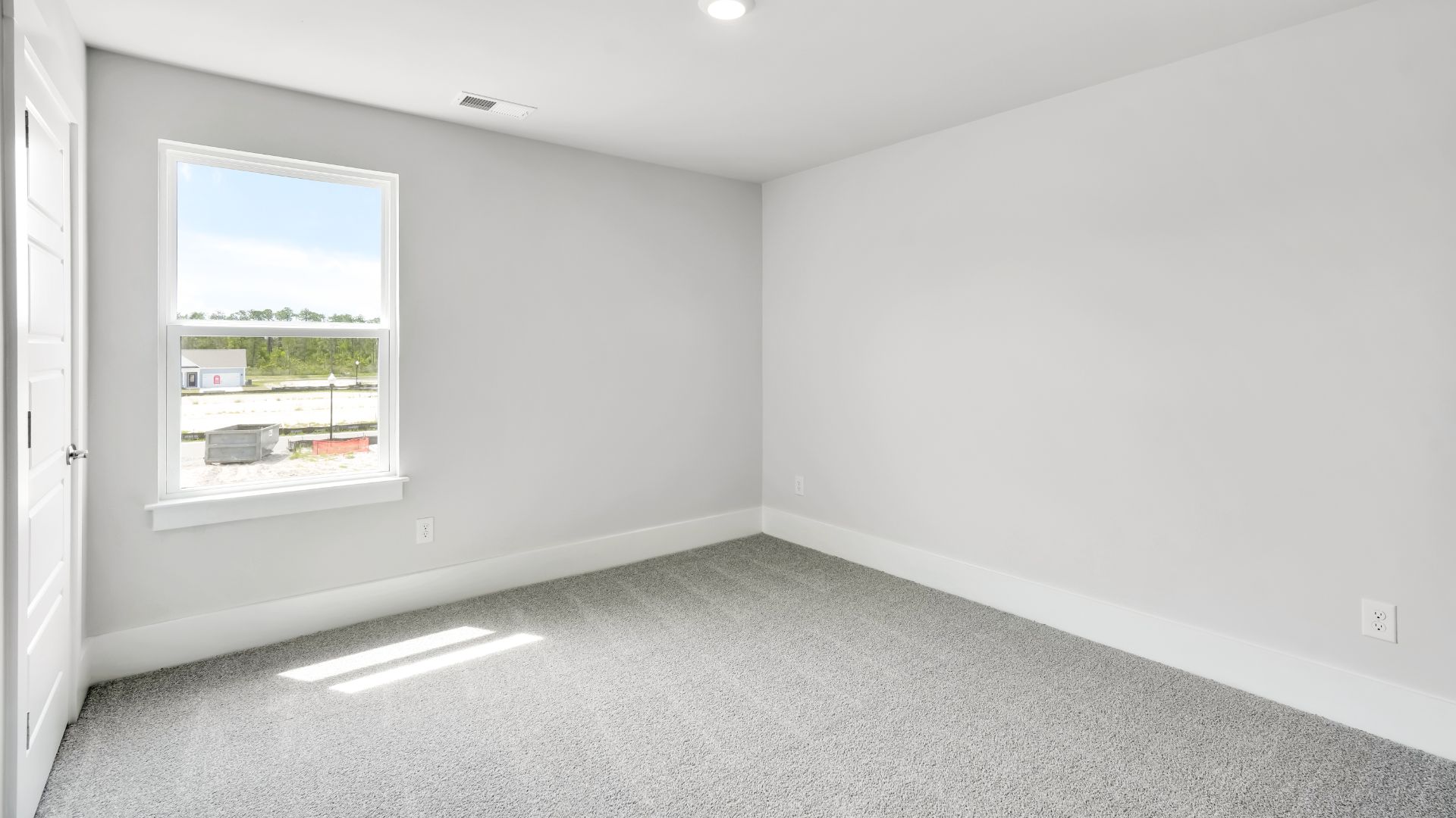 Upstairs, the Primary Suite offers a private bathroom, and the rest of the second floor includes three additional bedrooms and a convenient laundry room.