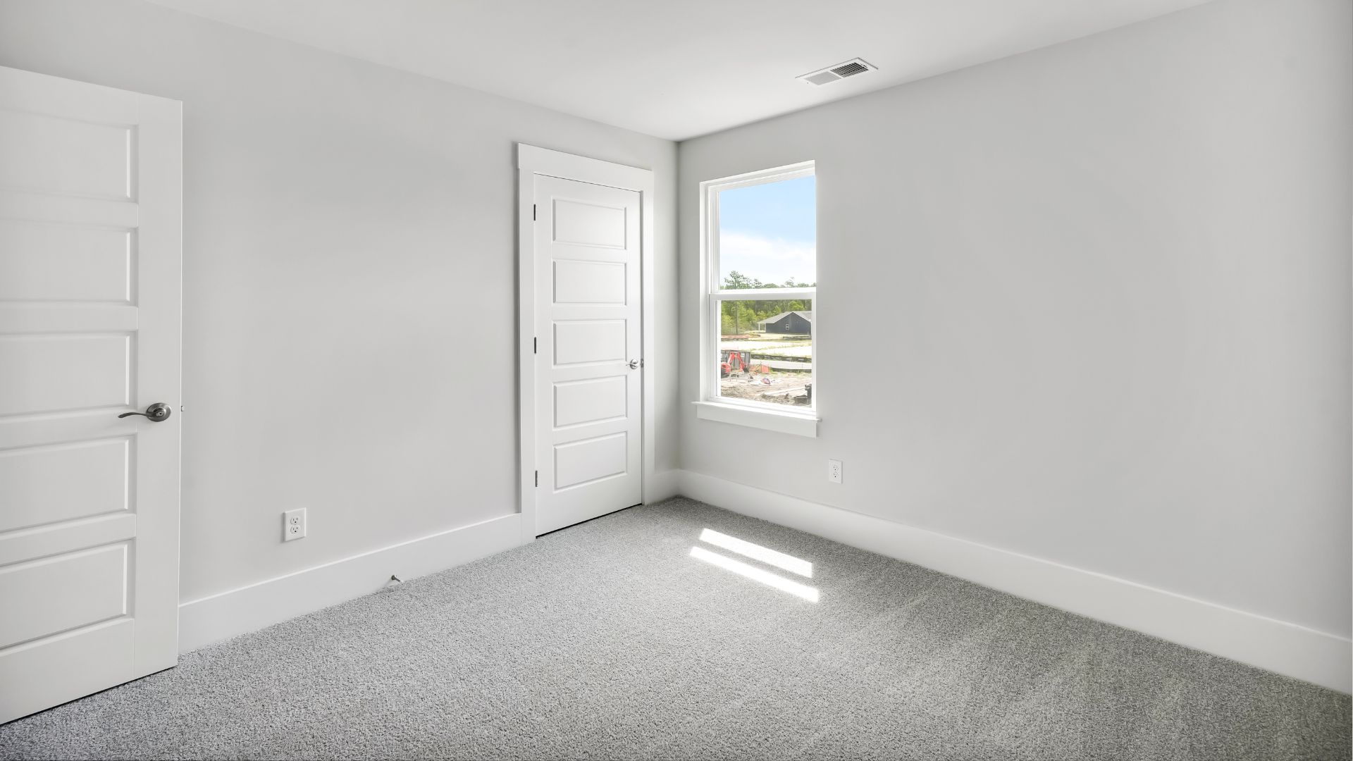 Upstairs, the Primary Suite offers a private bathroom, and the rest of the second floor includes three additional bedrooms and a convenient laundry room.