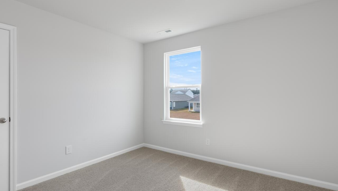 Upstairs, the Primary Suite offers a private bathroom, and the rest of the second floor includes three additional bedrooms and a convenient laundry room.